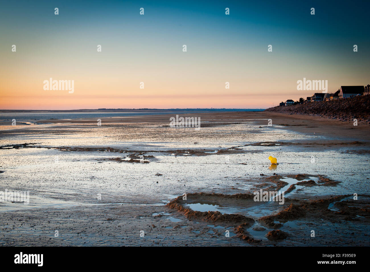 Scenic sunset landscape on a Normandy beach during low tide Stock Photo