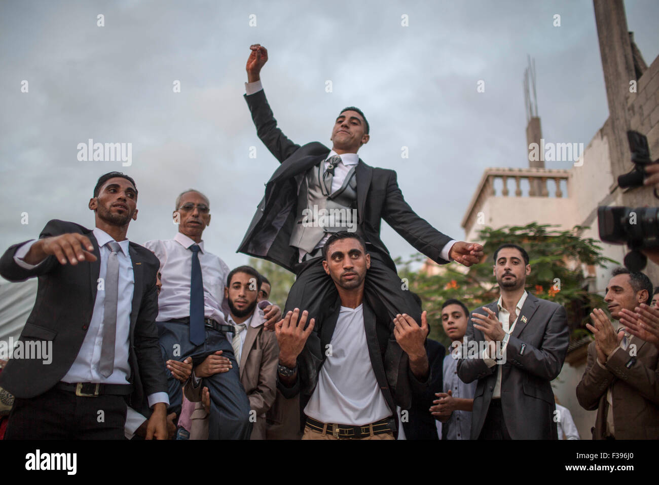Gaza, Gaza Strip town of Beit Hanun. 1st Oct, 2015. Palestinian groom Mohammed Yousef Al-Masri (C, top) dances with relatives during his wedding in the northern Gaza Strip town of Beit Hanun, on Oct. 1, 2015. © Wissam Nassar/Xinhua/Alamy Live News Stock Photo