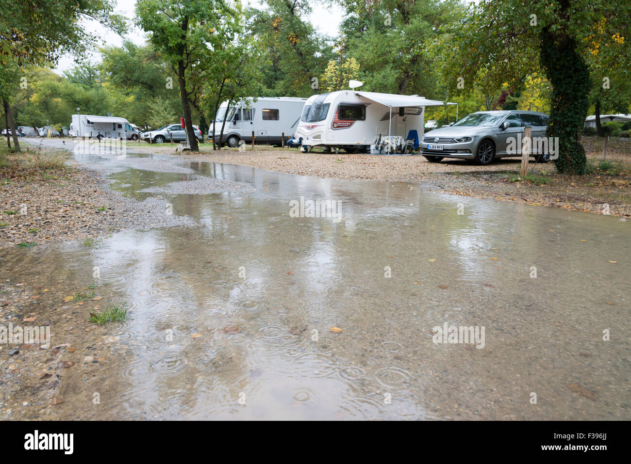 Greoux-Les-Bains, Provence, France. 2nd October, 2015. Torrential rain floods a campsite as an unseasonal weather system crosses the northern Mediterranean area of Europe. Many schools have been closed in Corsica which is expecting the worst of the weather with heavy rain coupled with strong winds. The rain is forecast to continue tomorrow. Credit:  Julian Eales/Alamy Live News Stock Photo
