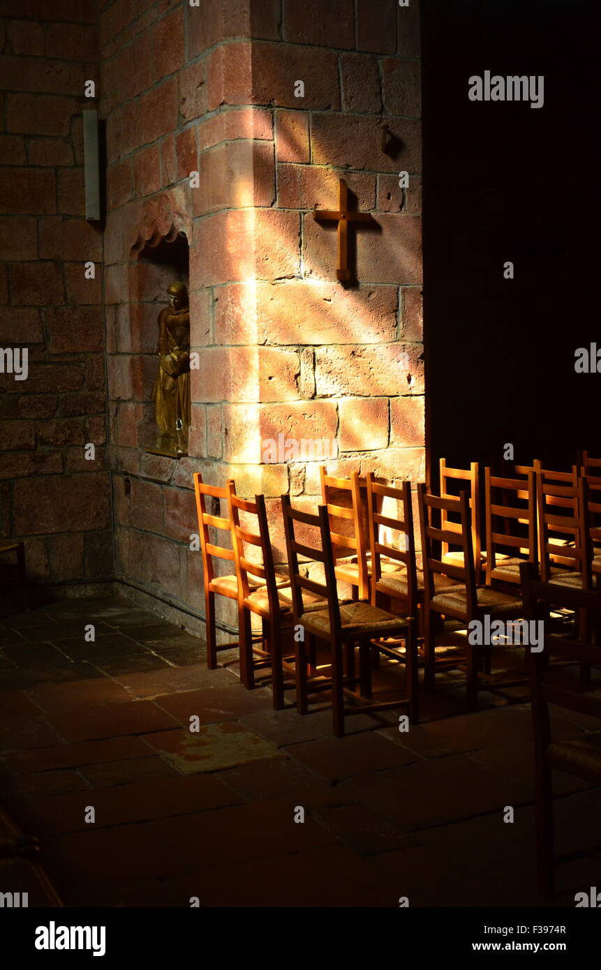 Inside of a catholic church, soft light on seats Stock Photo Alamy