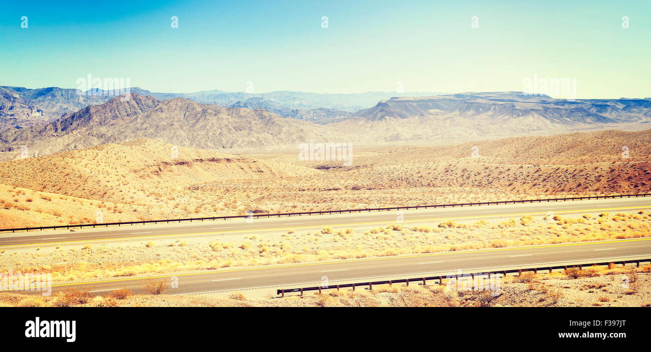 Retro toned panoramic country highway, USA. Stock Photo