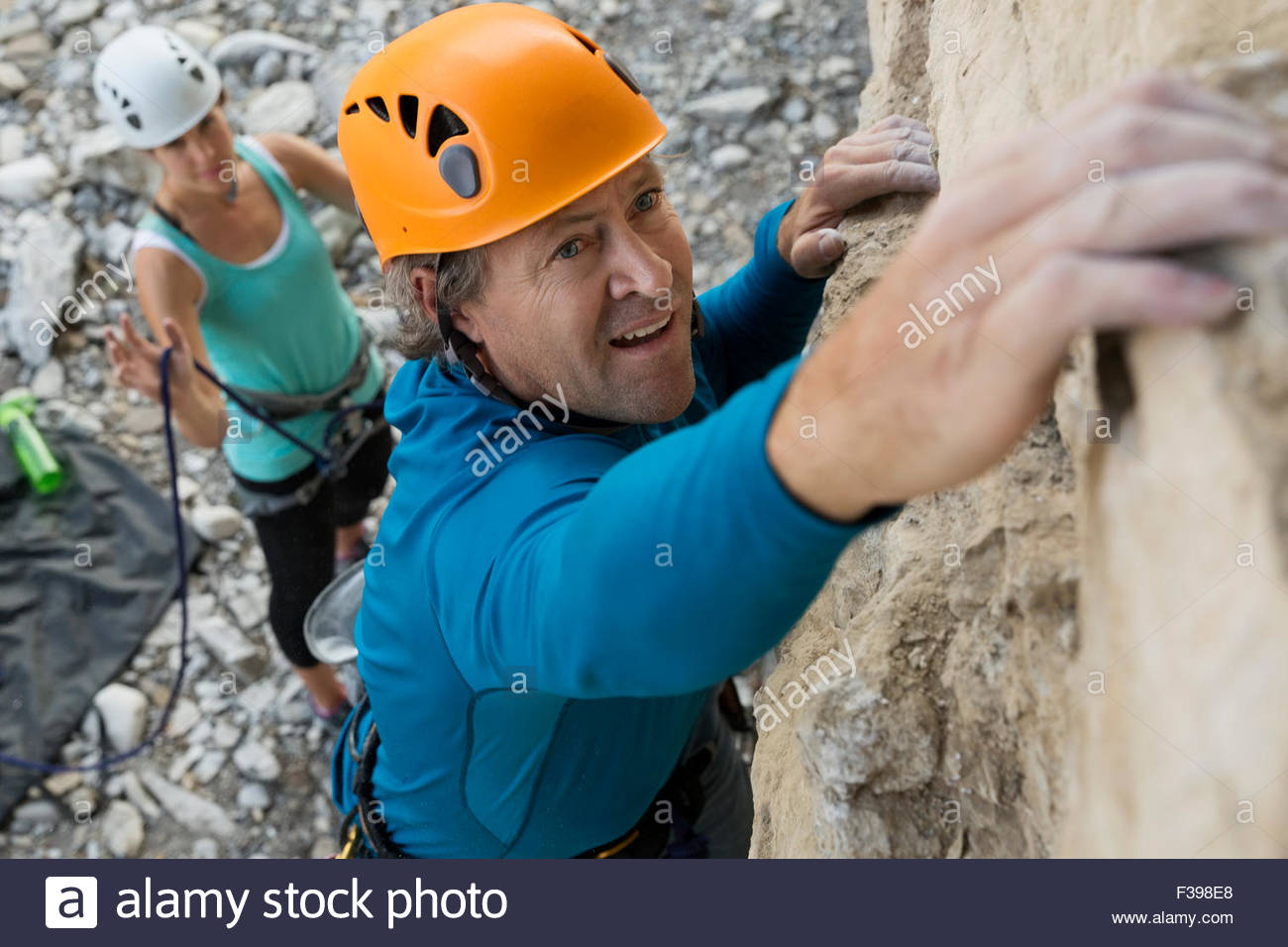 Focused man rock climbing Stock Photo