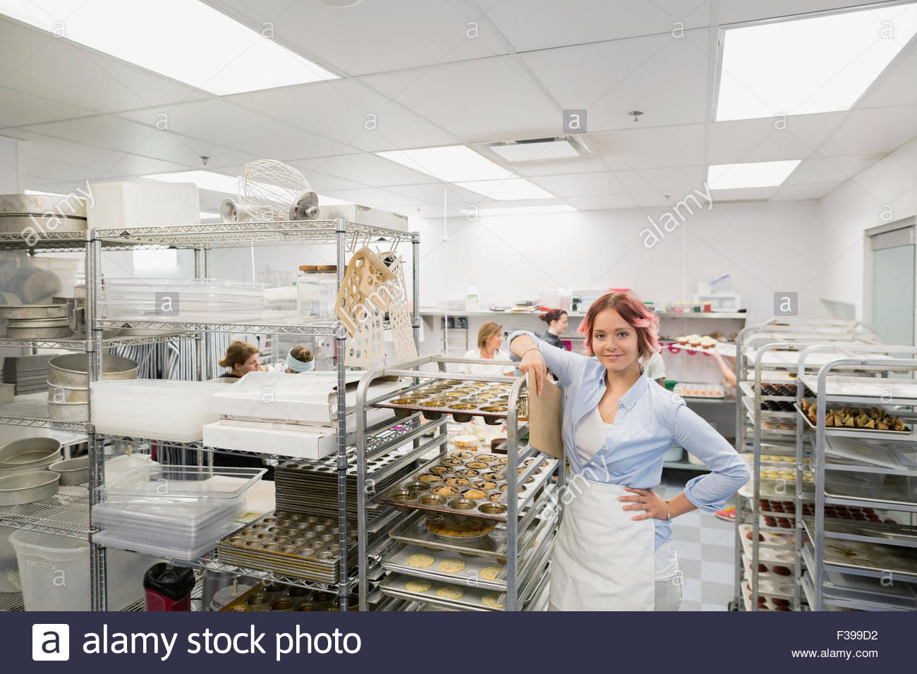 Portrait confident pastry chef in commercial kitchen Stock Photo