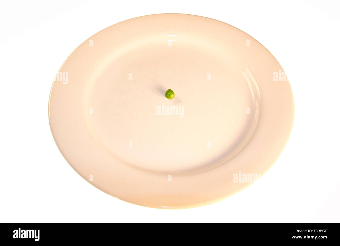 Diaet/ diet: Symbolbild: eine aus einer Bohne bestehende Mahlzeit/ a dish consisting only of one bean - Symbolbild Nahrungsmitte Stock Photo