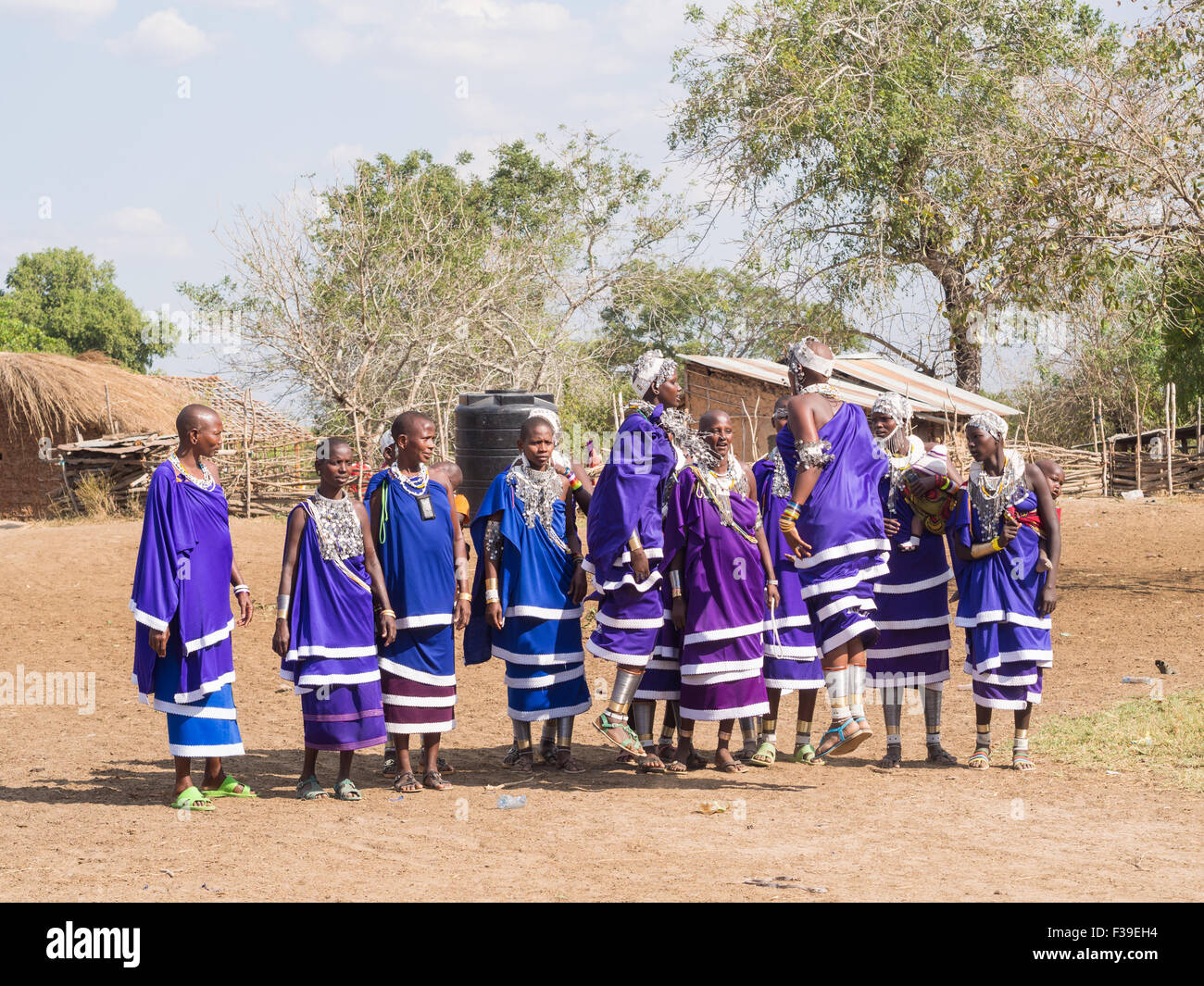 Maasai women dancing and singing during the ceremony of transition into a new age-set for boys and girls of their community. Stock Photo