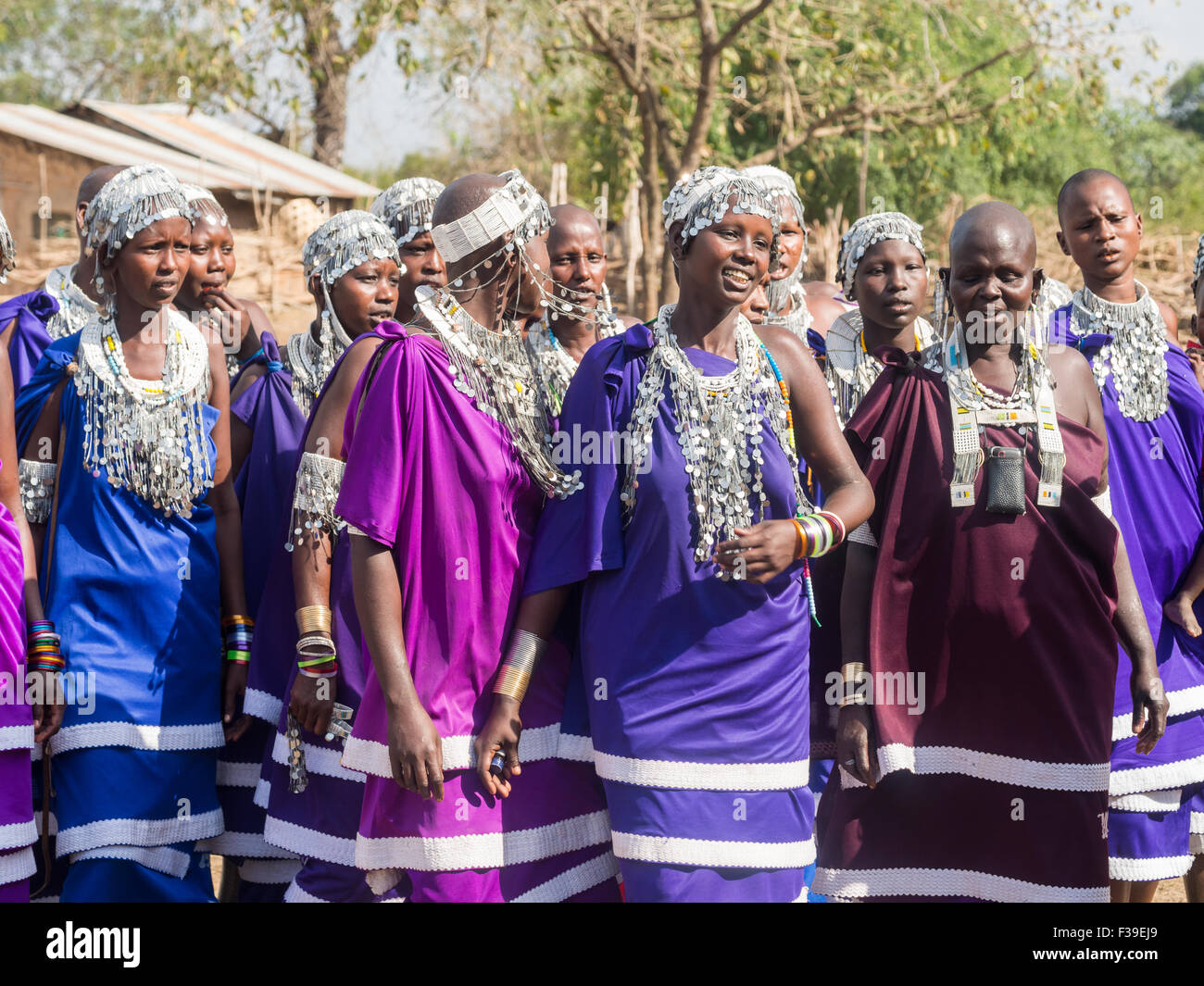 Maasai women dancing and singing during the ceremony of transition into a new age-set for young boys and girls. Stock Photo