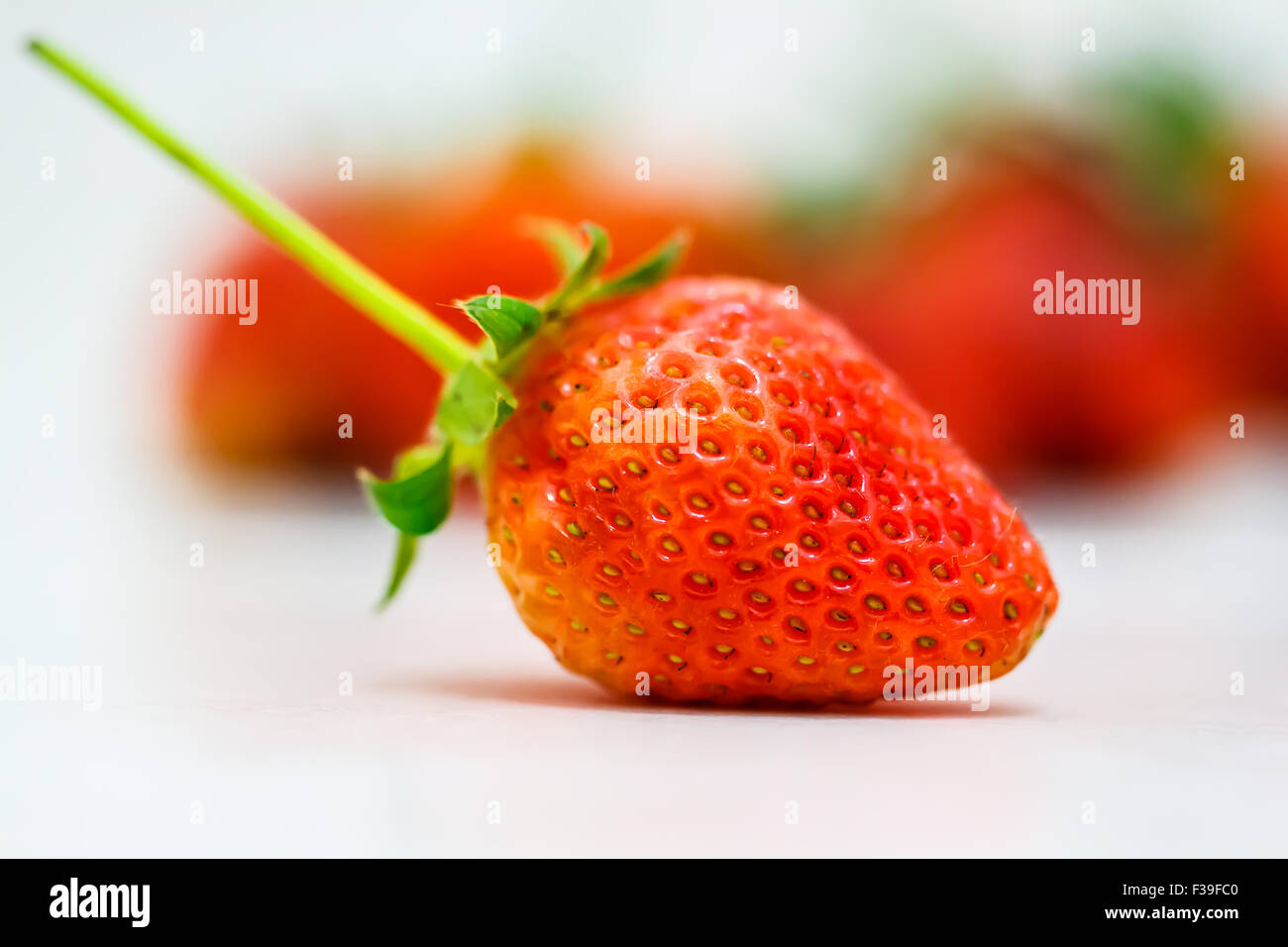 Strawberry berries on a white background Stock Photo - Alamy