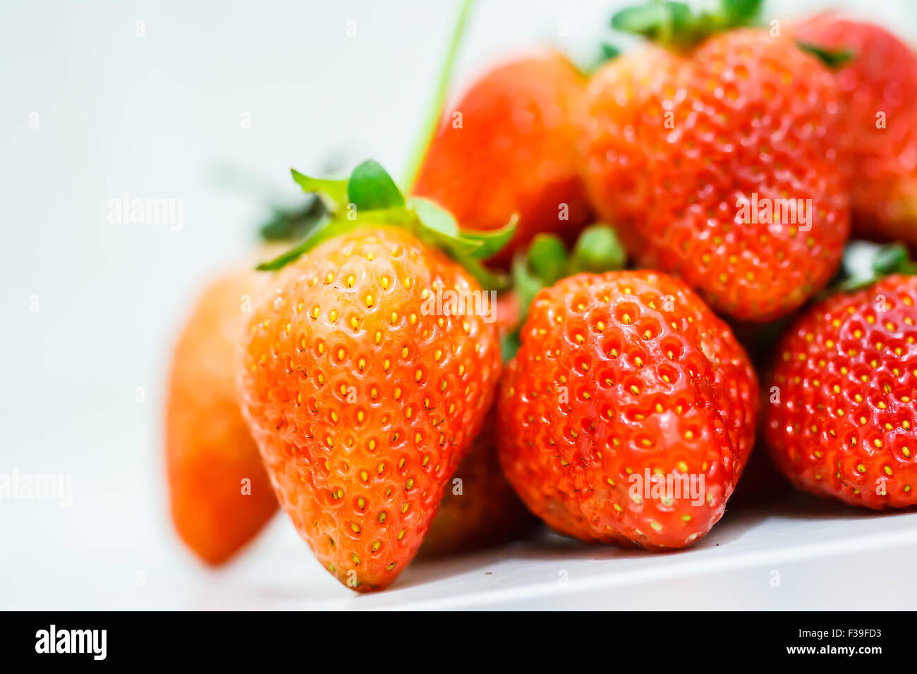 Strawberry berries on a white background Stock Photo - Alamy