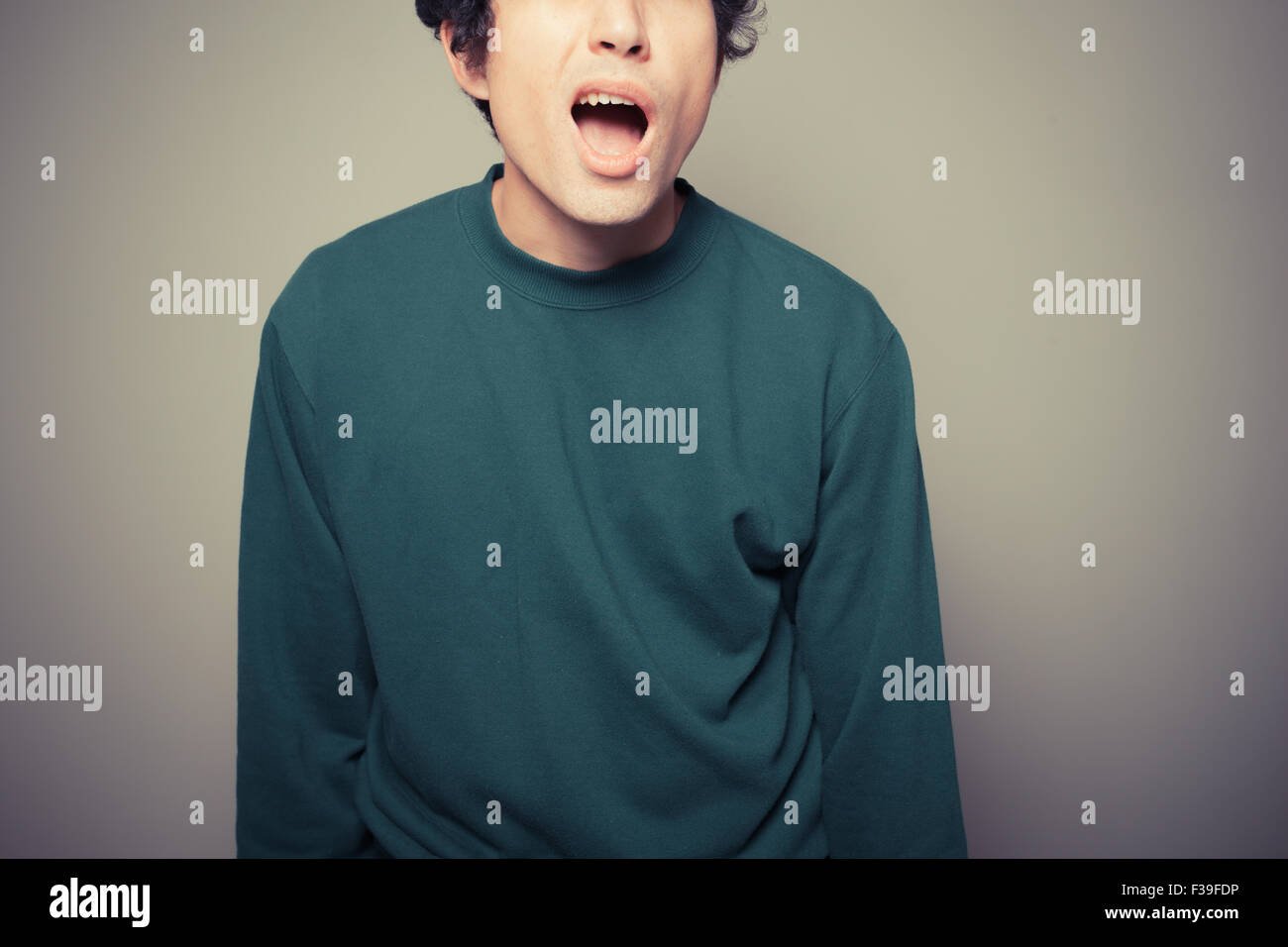A young man is gesturing and pulling silly faces Stock Photo Alamy