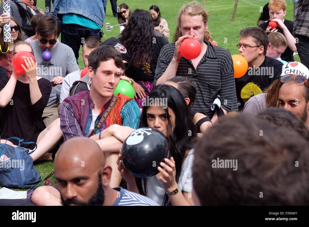 Protesters gather in Parliament Square for a mass inhalation of nitrous oxide against the proposed new law of 'possession of a psychoactive substance with intent to supply'  Featuring: Atmosphere Where: London, United Kingdom When: 01 Aug 2015 Stock Photo