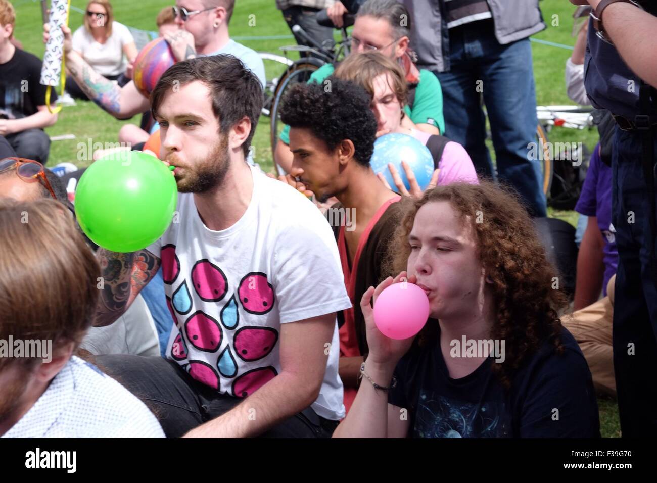 Protesters gather in Parliament Square for a mass inhalation of nitrous