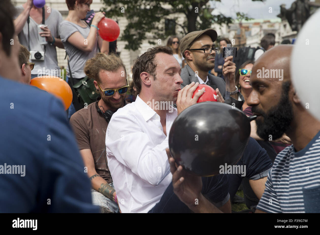 Protesters gather in Parliament Square for a mass inhalation of nitrous