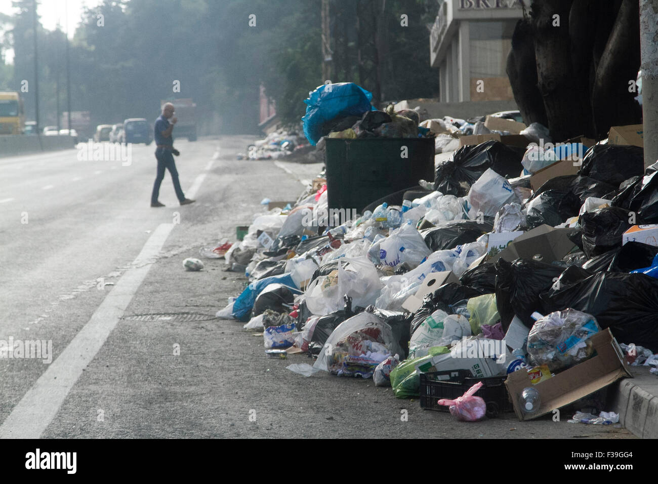 Beirut Lebanon. 2nd October 2015. Rubbish waste that has been piling over several weeks in the street of the Lebanese capital Beirut  spills onto to  a road as local municipalities struggle with the vast amount of rubbis Credit:  amer ghazzal/Alamy Live News Stock Photo