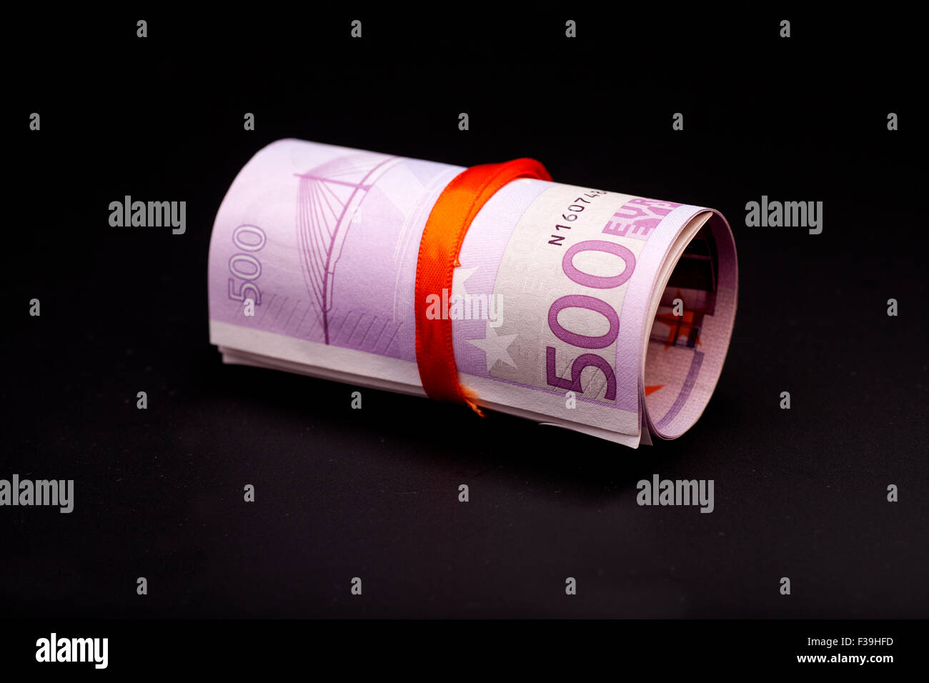 500 euro money in  red ribbon on black Stock Photo