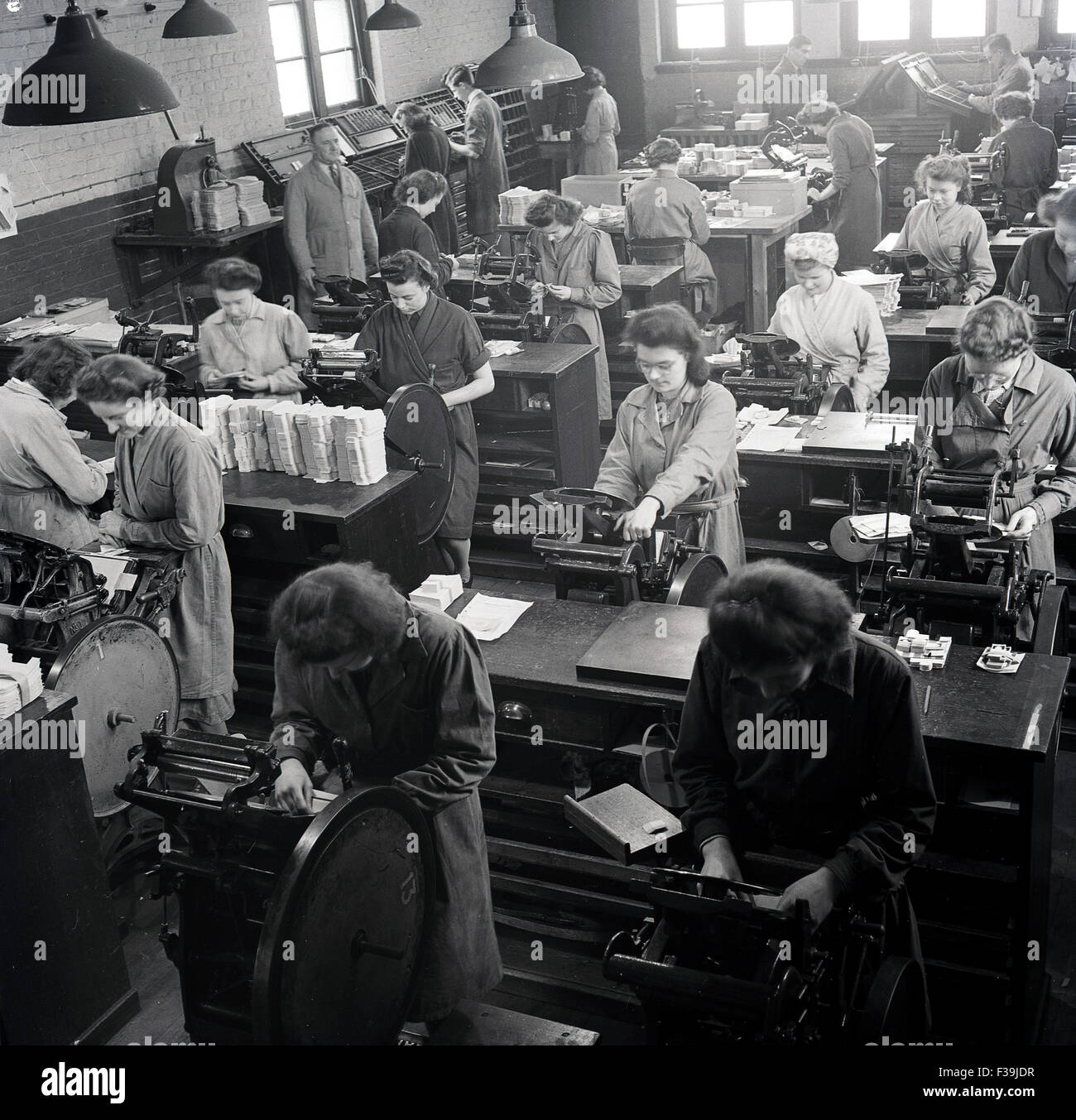 1950s, historical, female workers working in warehouse printing labels