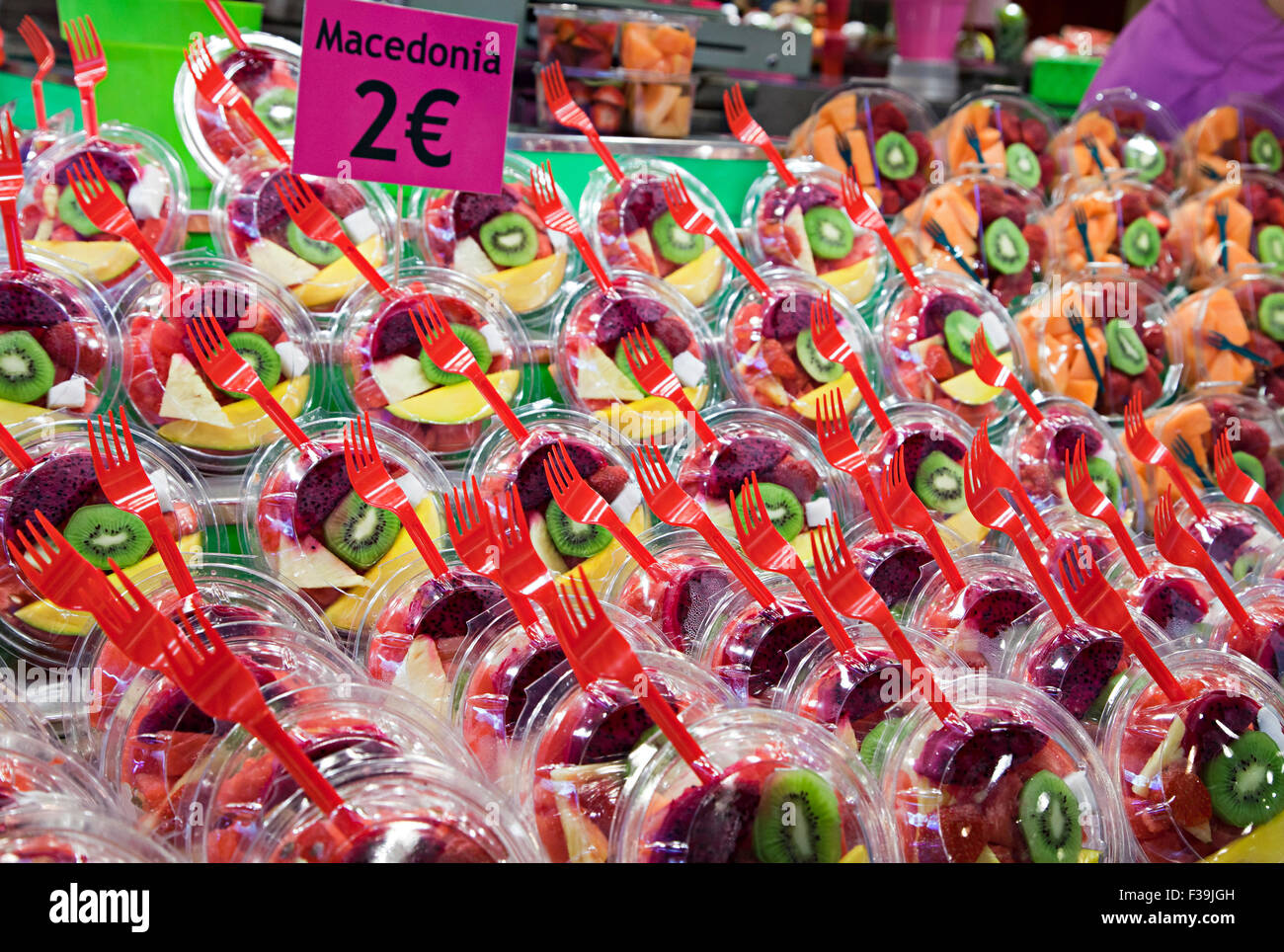 Fresh fruit salad in plastic cups on a Barcelona market Stock Photo