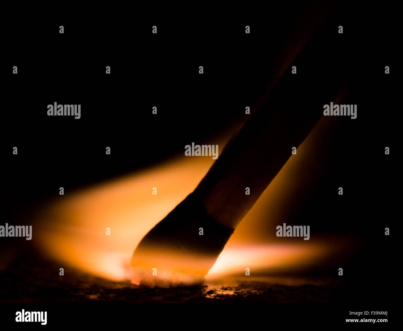 Struck Match shows motion, fire, and black background Stock Photo