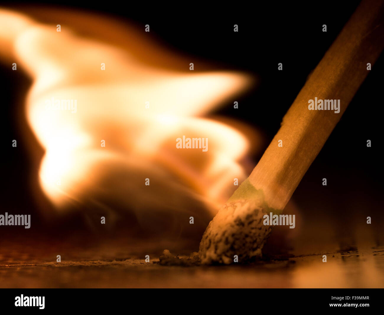 Struck Match shows motion, fire, and black background Stock Photo