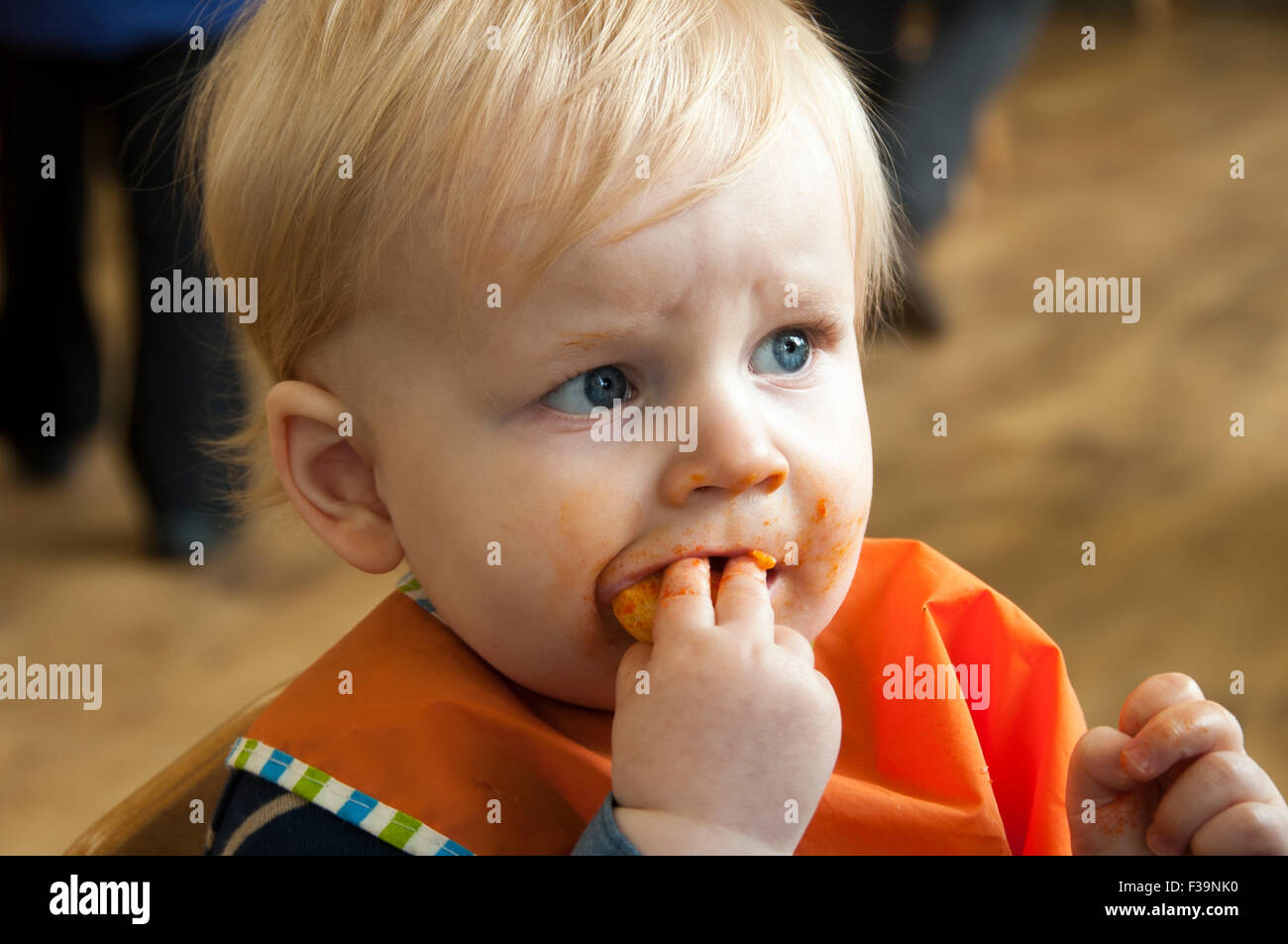 Baby boy eating lunch in a cafe Stock Photo