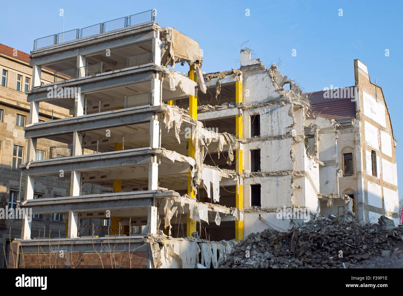 A building is been demolished with lots of debris Stock Photo