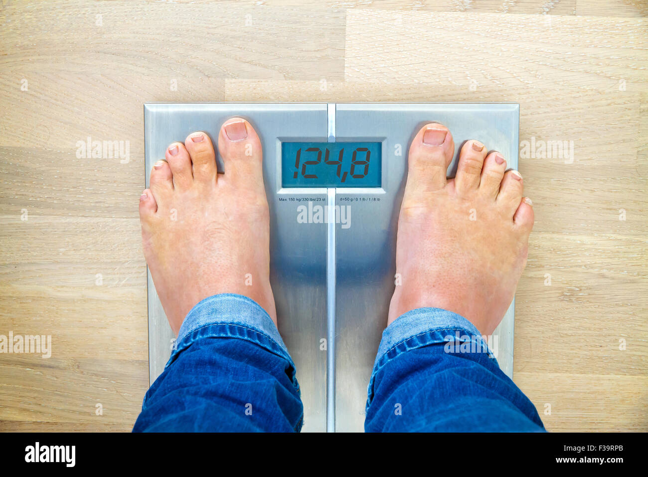 Man Standing On Weight Scales With Bare Foot View From Top Man Standing On Weight Scales With Bare Foot View From Top