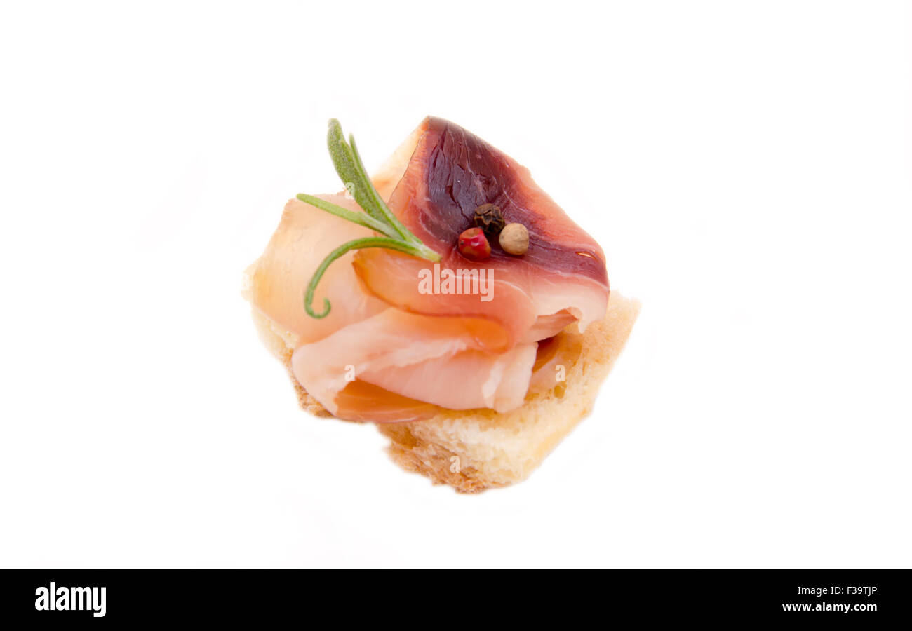 Smoked swordfish on toasted bread on white background Stock Photo