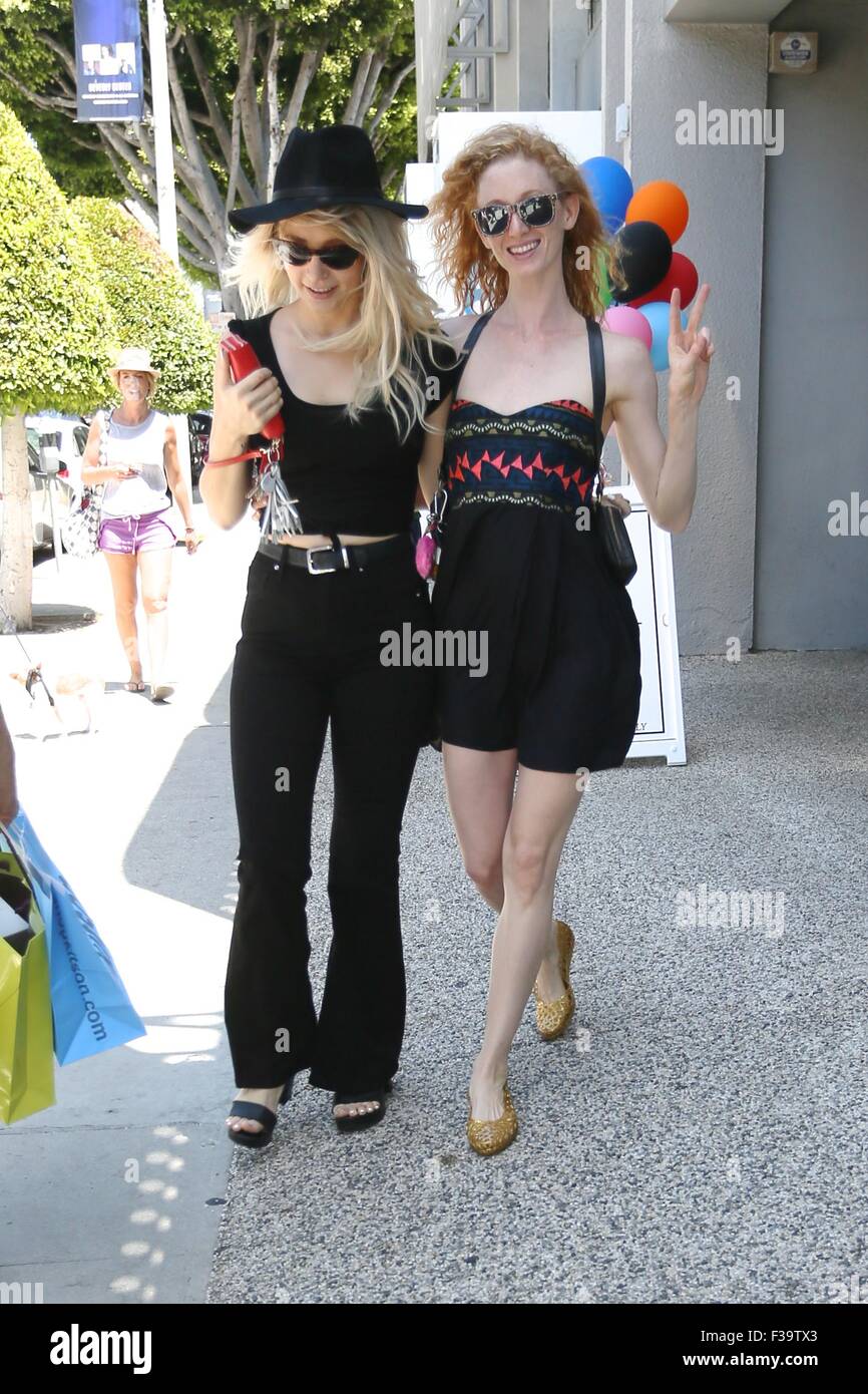 Jill Evyn and her girlfriend go shopping at Kitson and share a kiss on