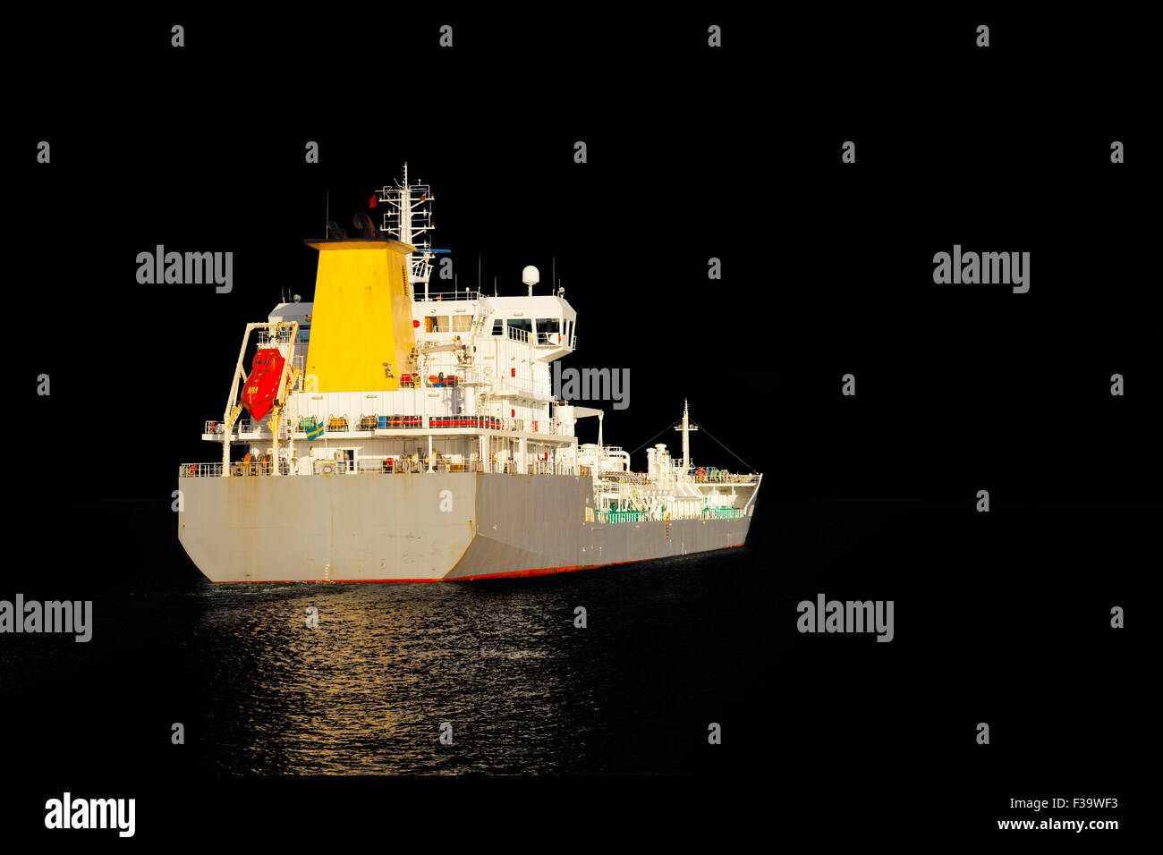 Photo of a tanker ship isolated on black background. Stock Photo