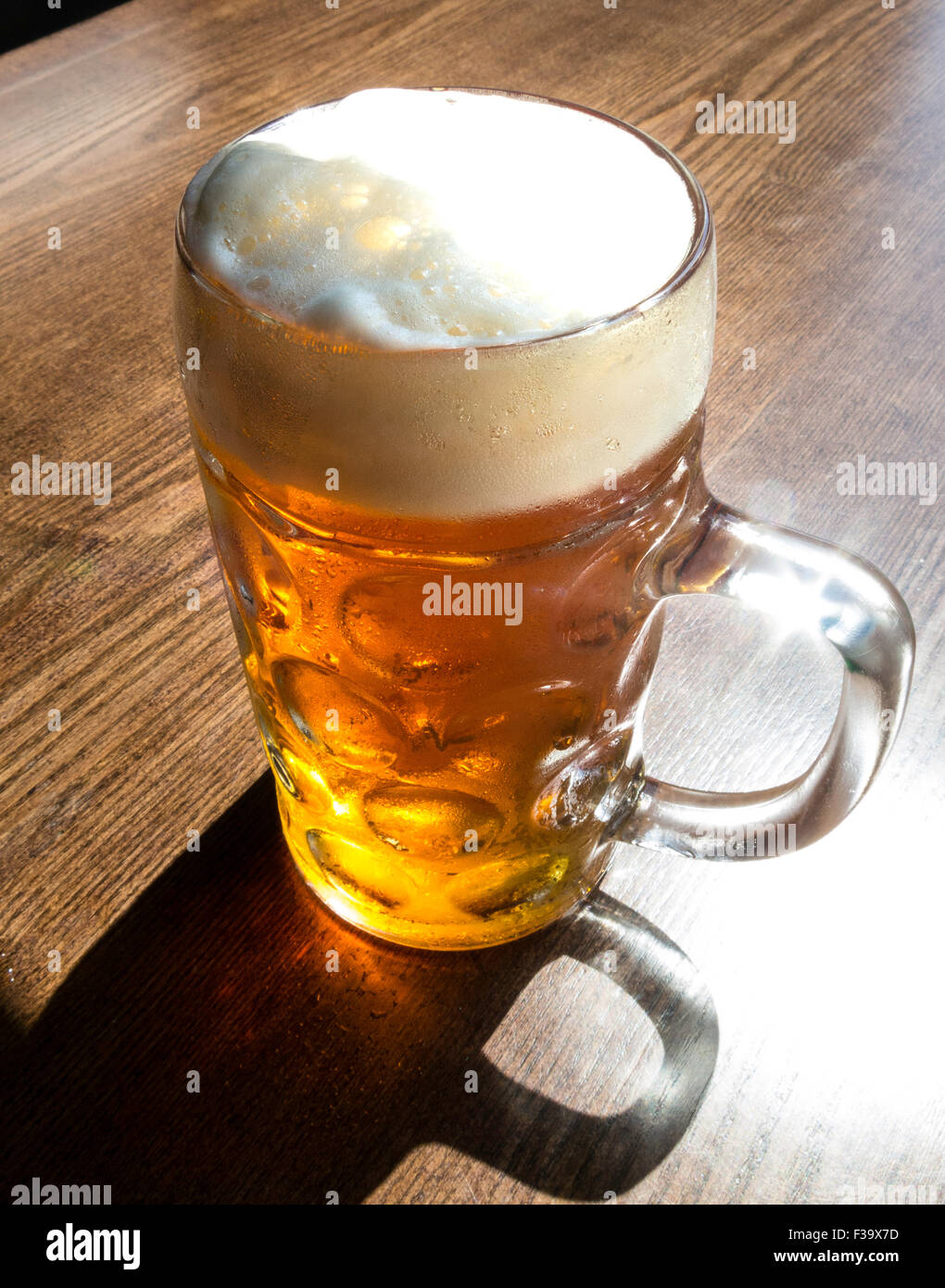 Close up of Freshly Poured Stein of Beer on Bar Stock Photo