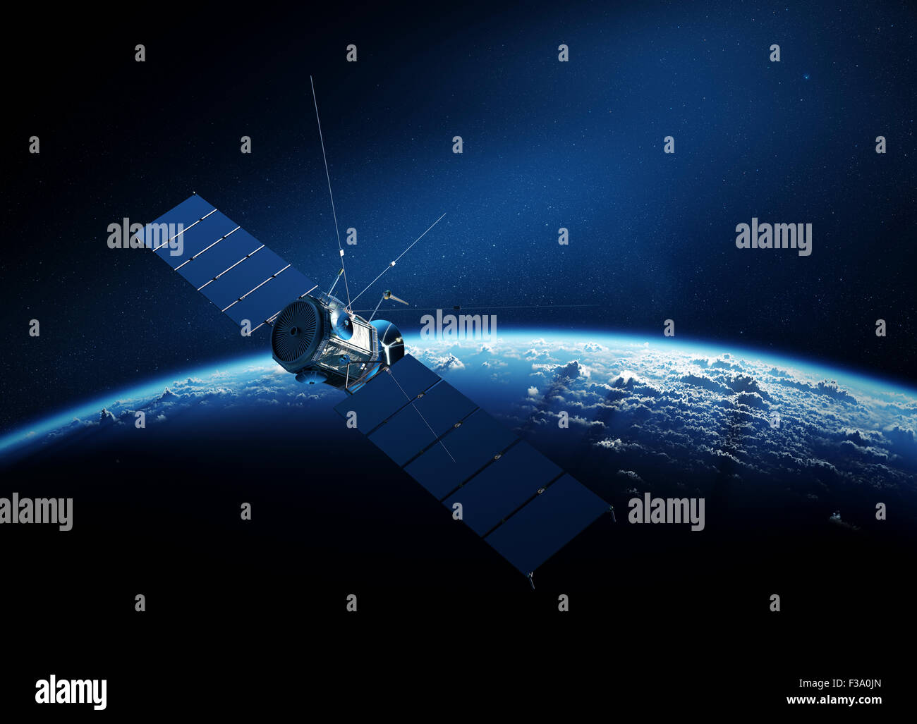 Communications satellite orbiting Earth with sunrise in space Stock Photo
