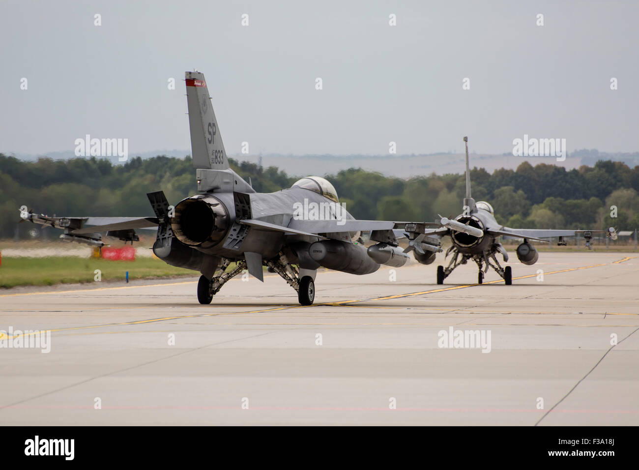 A pair of U.S. Air Force F-16C Fighting Falcons taxiing on the runway in Ostrava, Czech Republic. Stock Photo