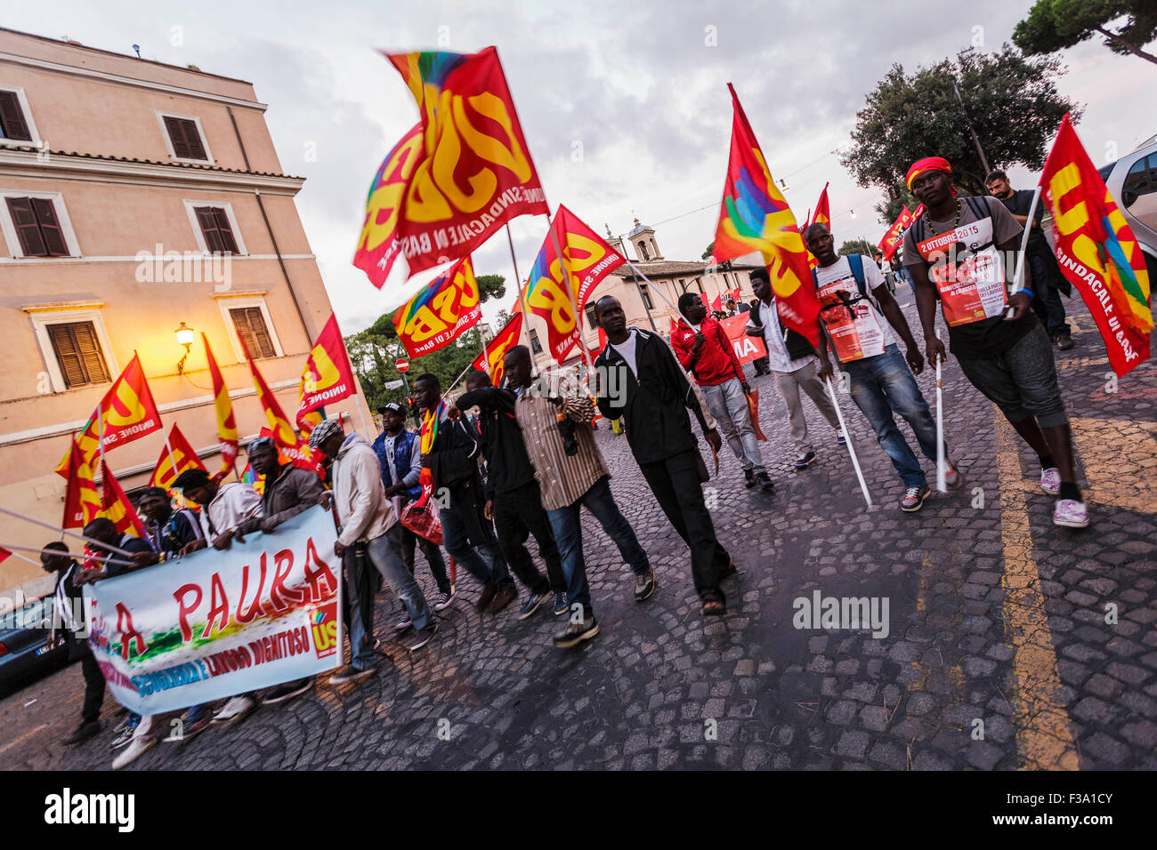 Rome, Italy. 02nd Oct, 2015. People bring banners and shout slogans during a demonstration to defend 'the public goods and services' against the projects of privatization and exploitation followed by the Mayor Ignazio Marino' in Rome. USB (Unione Sindacale di Base) trade union says that, Marino according with the government Renzi is following the lines of EU that impose the sale of the public services to the private big companies'. © Giuseppe Ciccia/Pacific Press/Alamy Live News Stock Photo