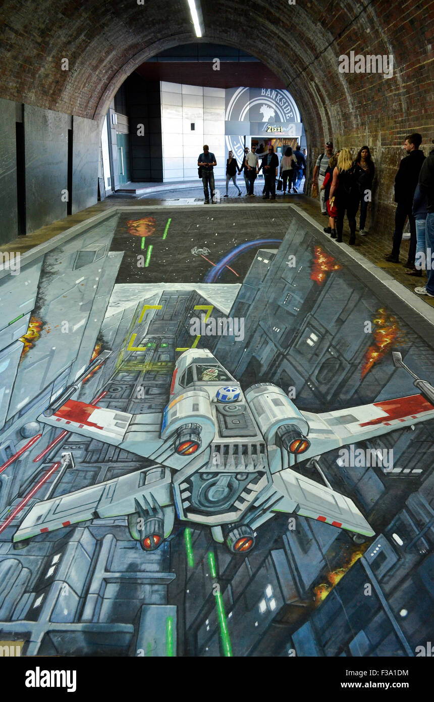 A 3-D Star Wars painting by Joe and Max which appeared in the pedestrian tunnel under Southwark Bridge, London, 1st-2nd October 2015, to coincide with the UK release of the Rise Against The Empire play set. The painting, which was 49 feet (15 metres) long, has both bemused regular commuters and drawn crowds of tourists keen to see it throughout the two days, and shows the attack on the Death Star by Luke Skywalker's X-Wing. Credit:  Antony Nettle/Alamy Live News Stock Photo