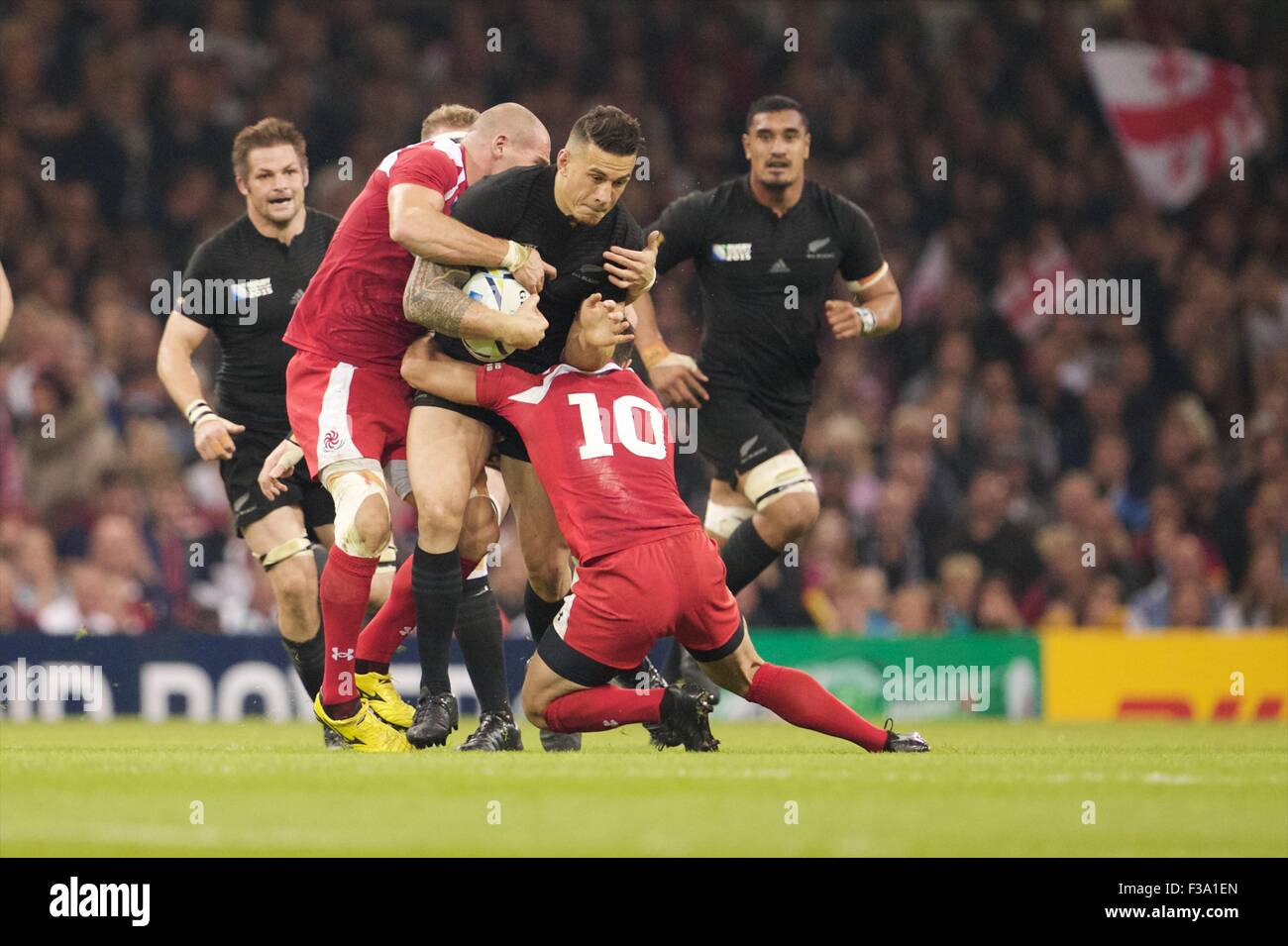 Millennium Stadium, Cardiff, Wales. 02nd Oct, 2015. Rugby World Cup. New Zealand versus Georgia. New Zealand All Black centre Sonny Bill Williams is tackled by Georgia fly-half Lasha Malaghuradze. Credit:  Action Plus Sports/Alamy Live News Stock Photo