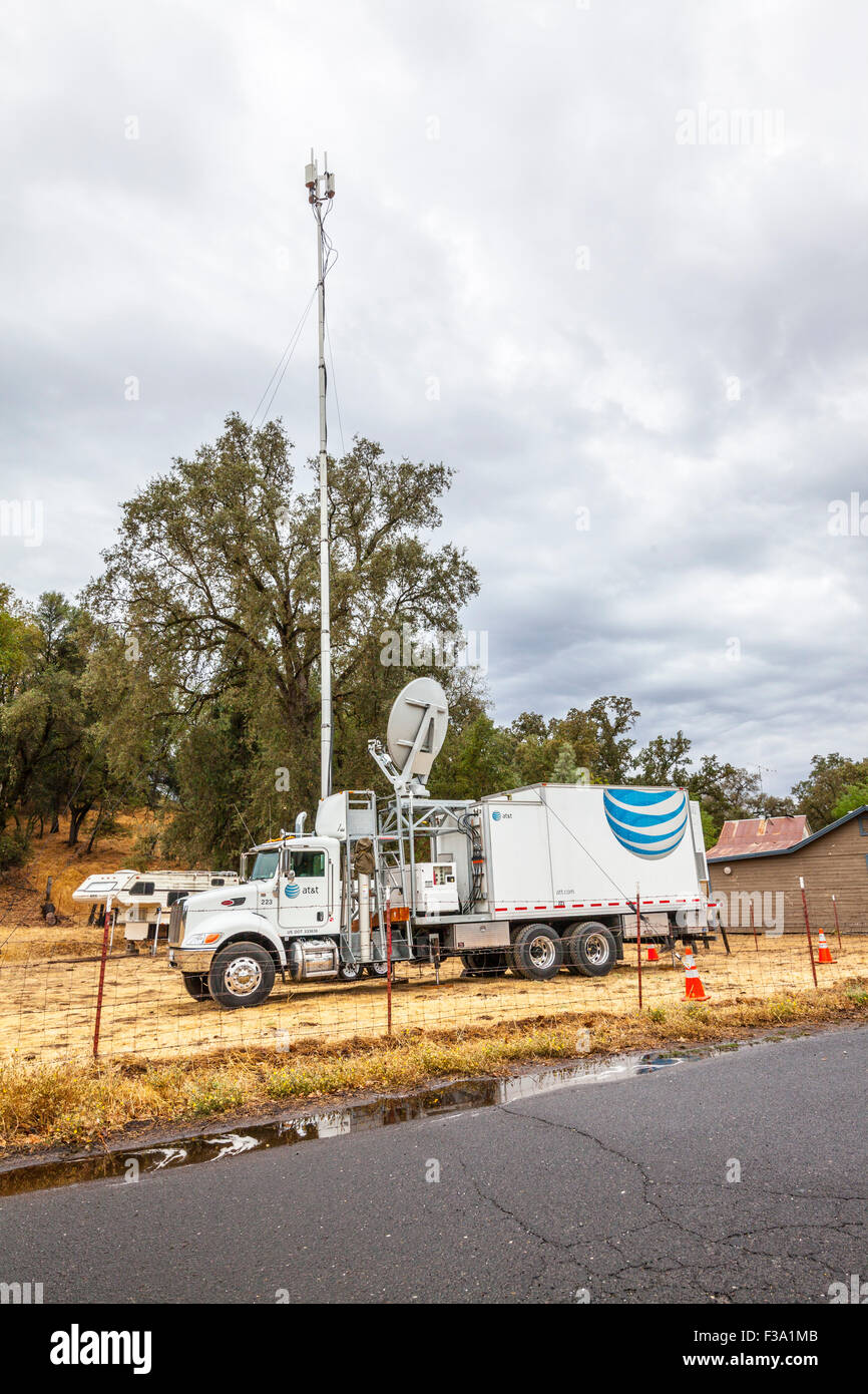 An AT&T truck with a mobile phone antenna providing service after the Butte Fire in California Stock Photo