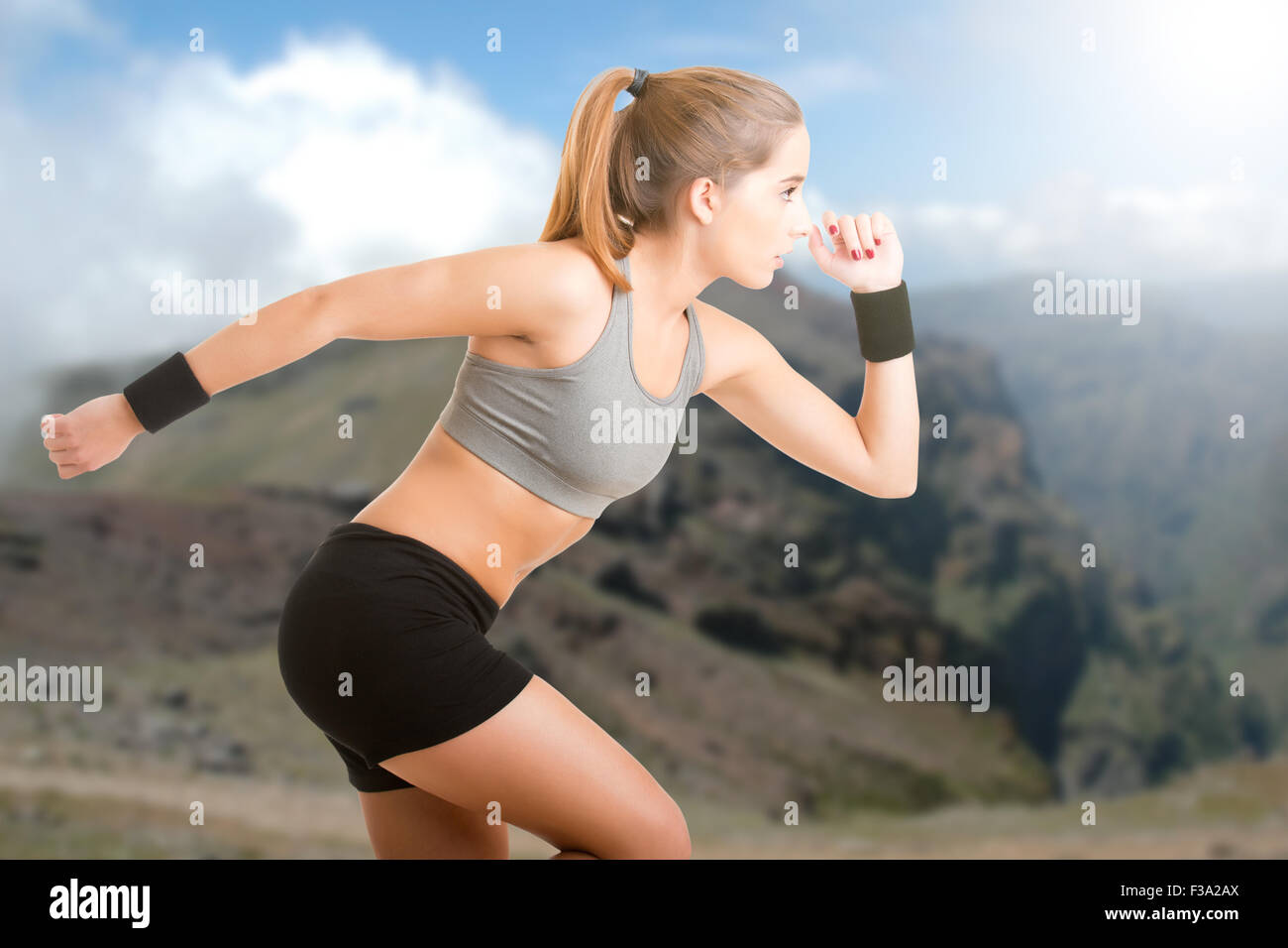 Young fit woman jogging in the nature Stock Photo