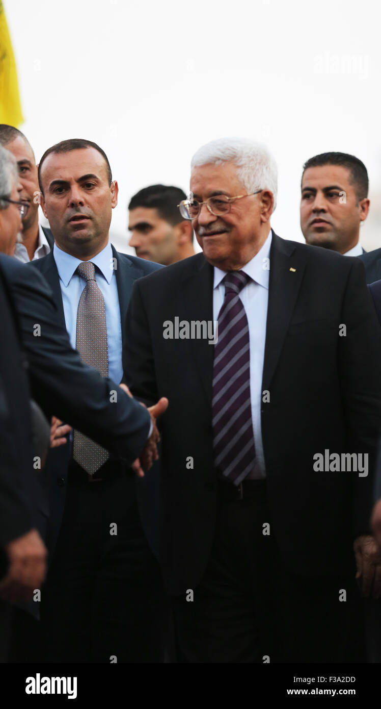 Palestinian Authority President Mahmoud Abbas greets Fatah party supports in the West Bank city of Ramallah. Palestinian President, Mahmoud Abbas, also known as Abu Mazen, was greeted Friday evening by supporters of the ruling Fatah party in the West Bank city of Ramallah, after returning from his trip to New York City, where he spoke to the United Nation's General Assembly during the United Nations 70th anniversary. President Abbas reiterated to the Palestinian crowd in Ramallah, what he had said in his speech to the United Nations General Assembly. He warned that if Israel continues its prov Stock Photo