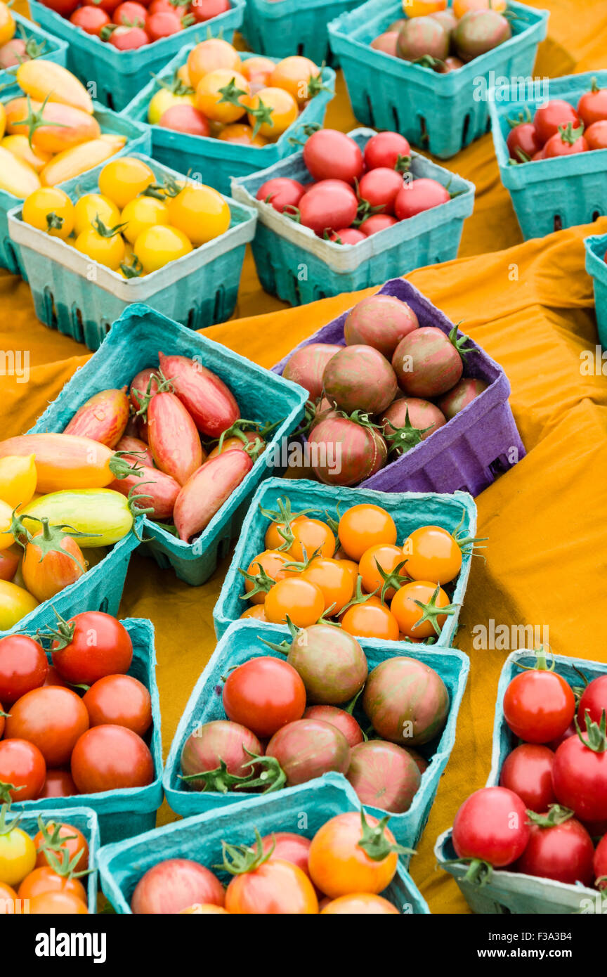 Boxes of small cherry tomatoes on display at the market Stock Photo - Alamy