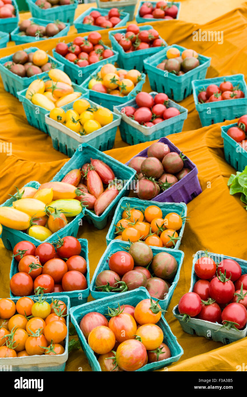 Boxes of small cherry tomatoes on display at the market Stock Photo - Alamy