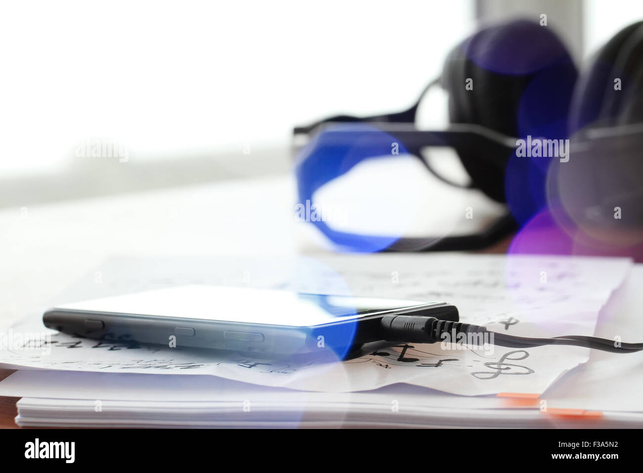 composing music concept with shallow DOF evenly matched jack of headphone and copy space Stock Photo