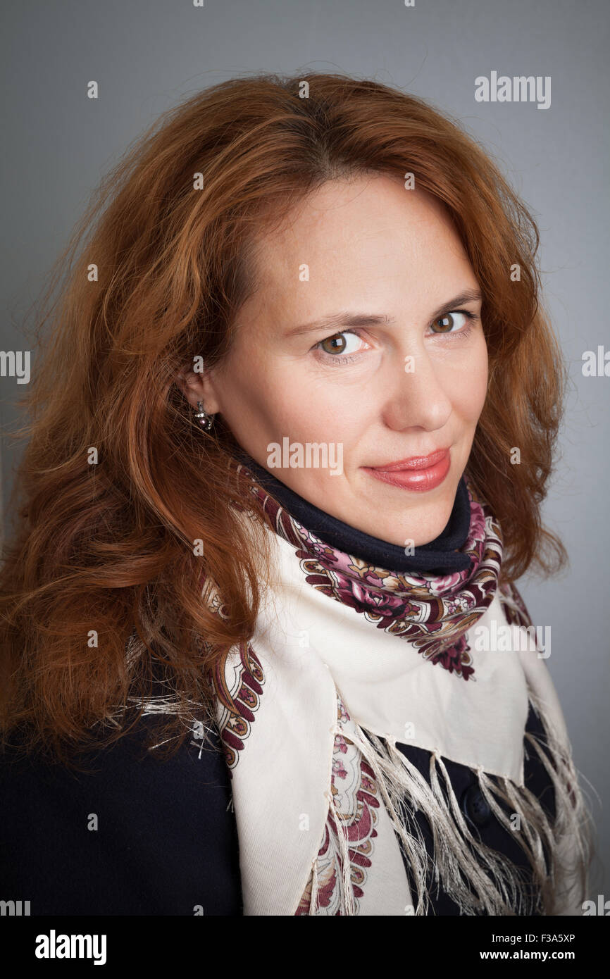 Beautiful Young Caucasian woman portrait with traditional Russian Pavloposadskie scarf Stock Photo