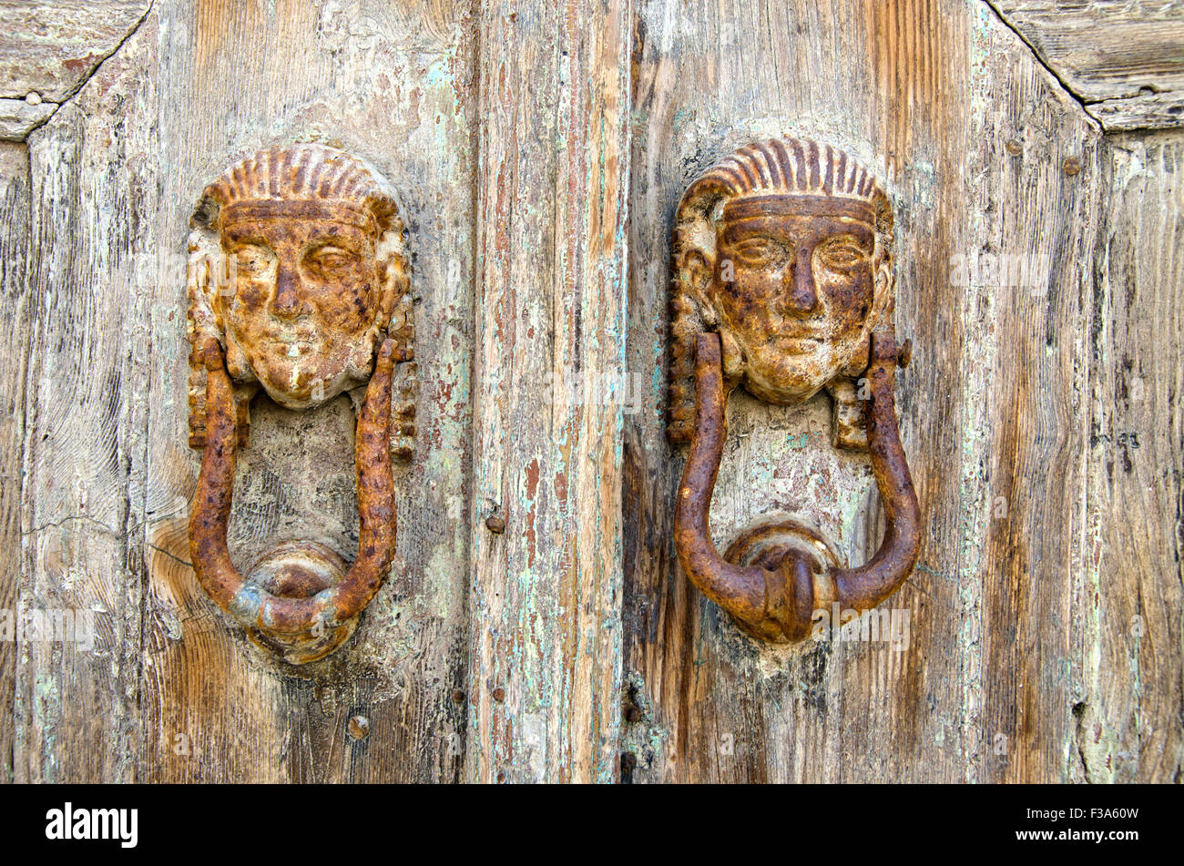 rusty Antique door knockers in Greek island Stock Photo