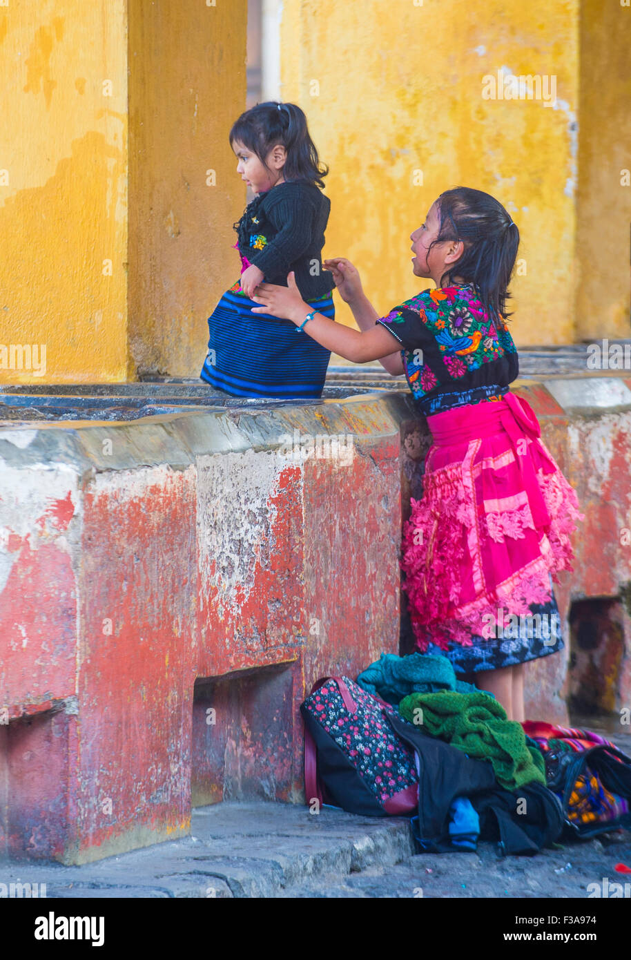 Guatemalan woman wash laundry in a traditional street washing facility in Antigua, Guatemala Stock Photo