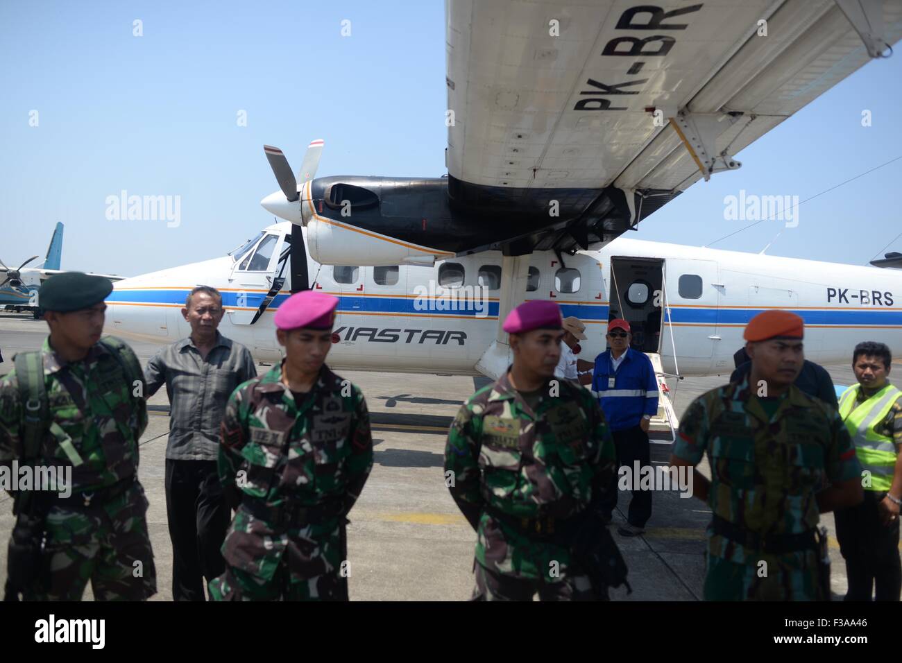 Jakarta, Indonesia. 3rd Oct, 2015. Soldiers prepare to search the Aviastar aircraft reported missing at Sultan Hasanuddin airport in Makassar, South Sulawesi, Indonesia, on Oct. 3, 2015. A small passenger plane with 10 people aboard lost contact near Sulawesi Island in eastern Indonesia on Friday, a Transport Ministry official said. © Lukas/Xinhua/Alamy Live News Stock Photo