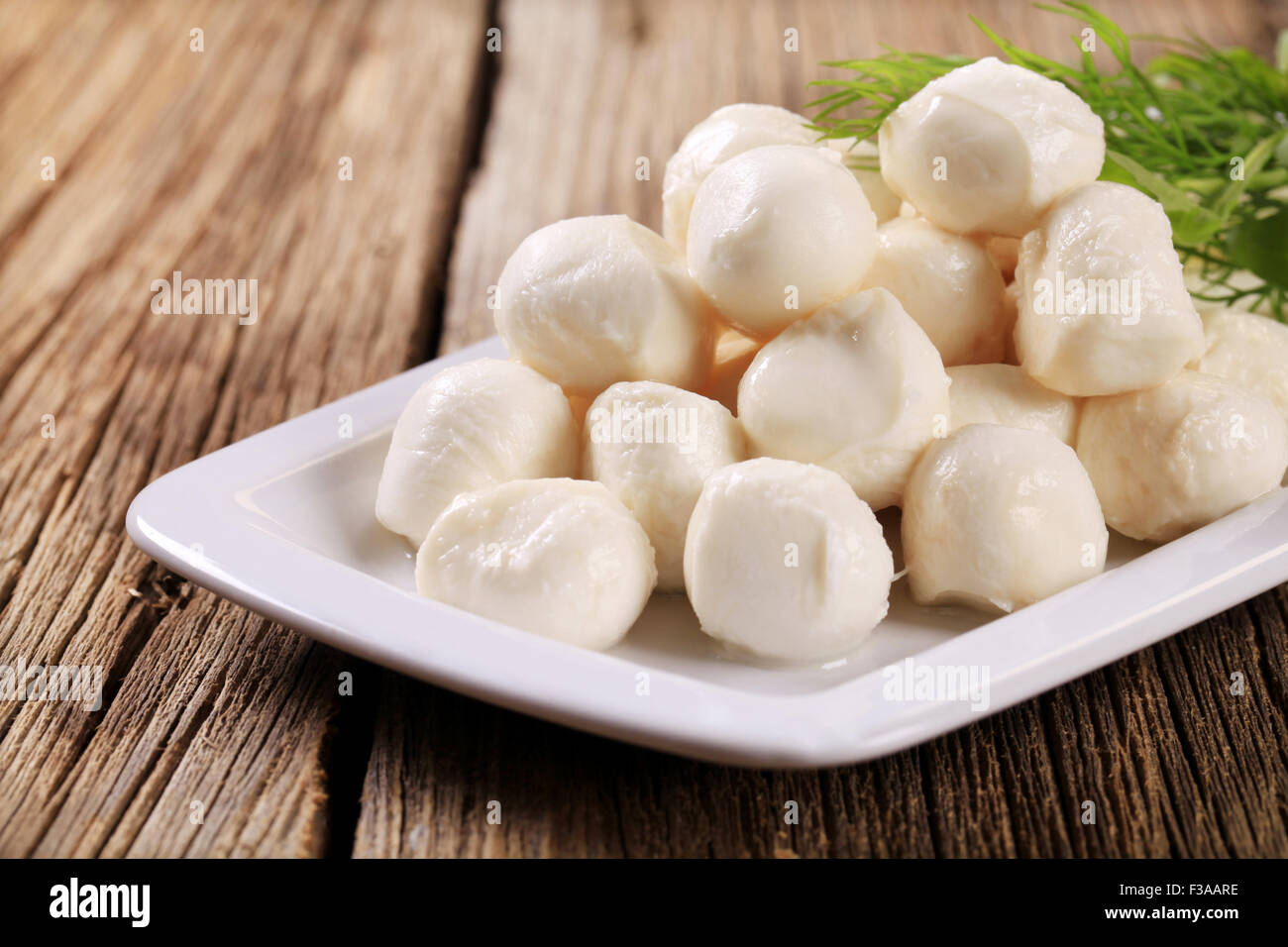 Fresh mozzarella cheese balls on a platter Stock Photo Alamy