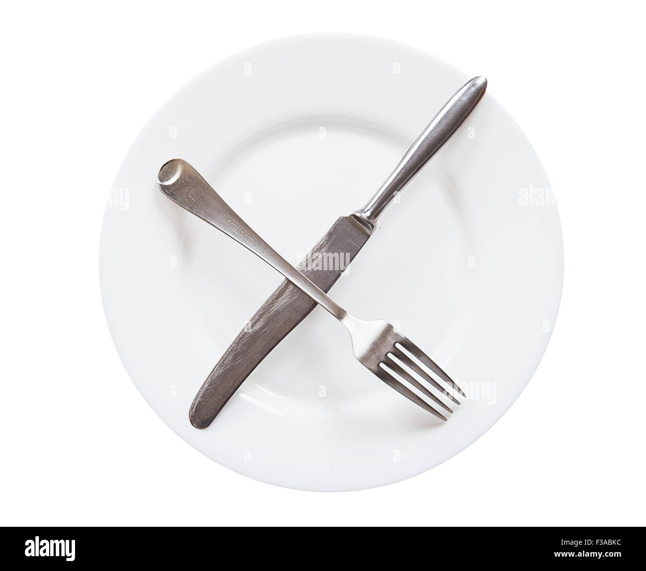 Empty white plate with knife and fork isolated on white background ...