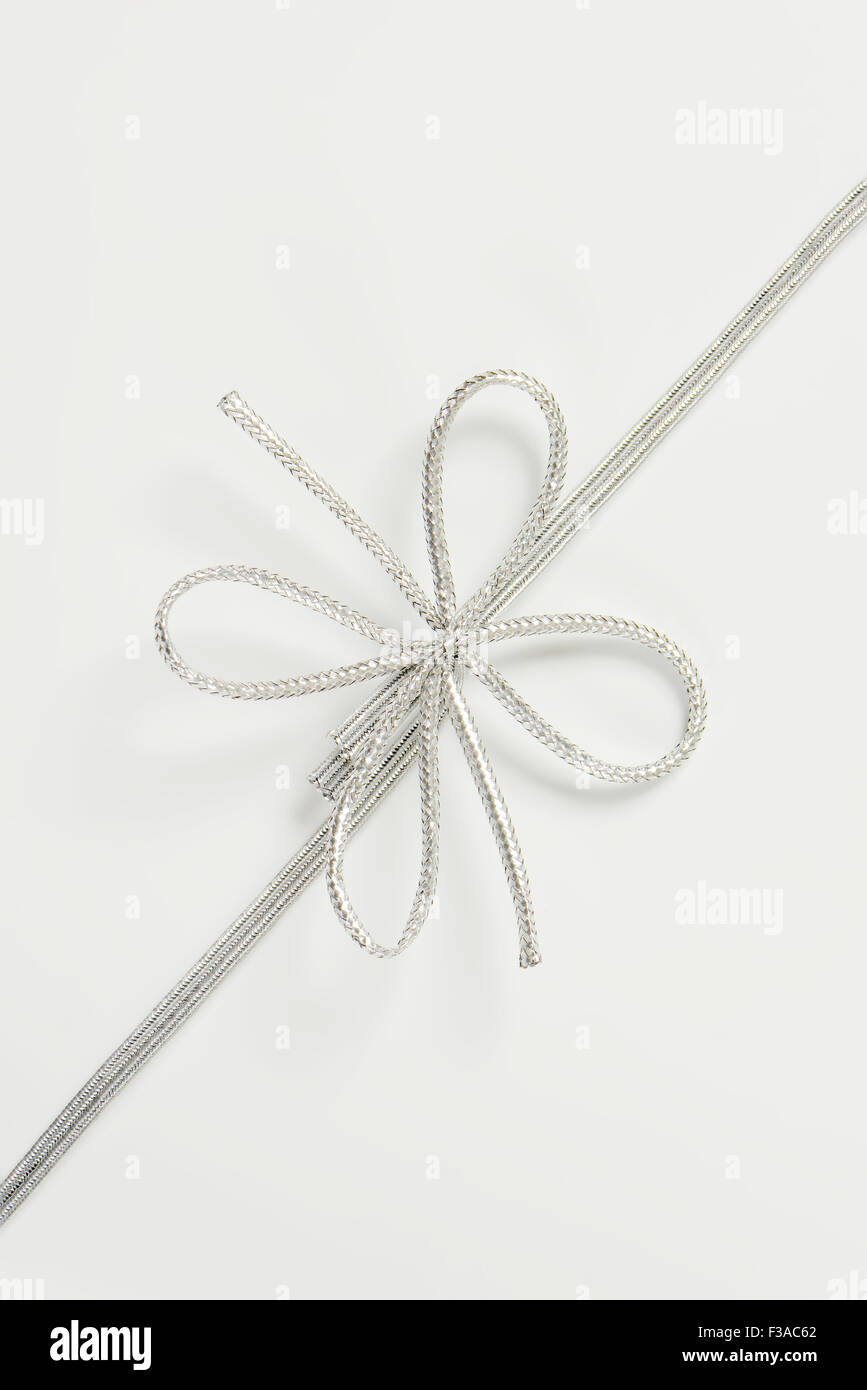 silver ribbon on white background Stock Photo - Alamy