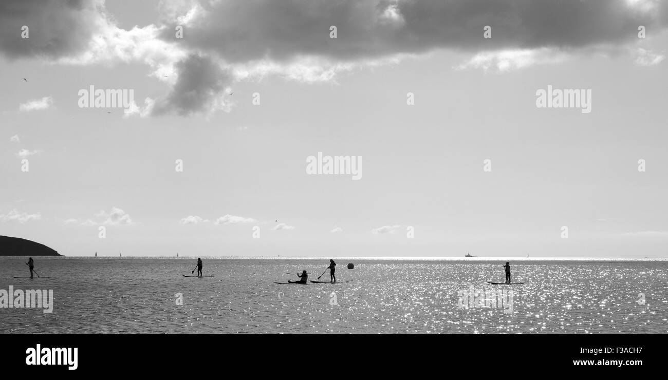 Paddleboarders having lessons in Falmouth Stock Photo