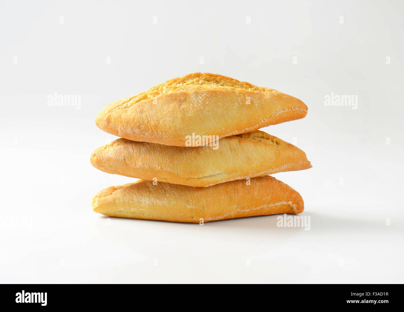 Three diamondshaped crusty dinner rolls Stock Photo Alamy