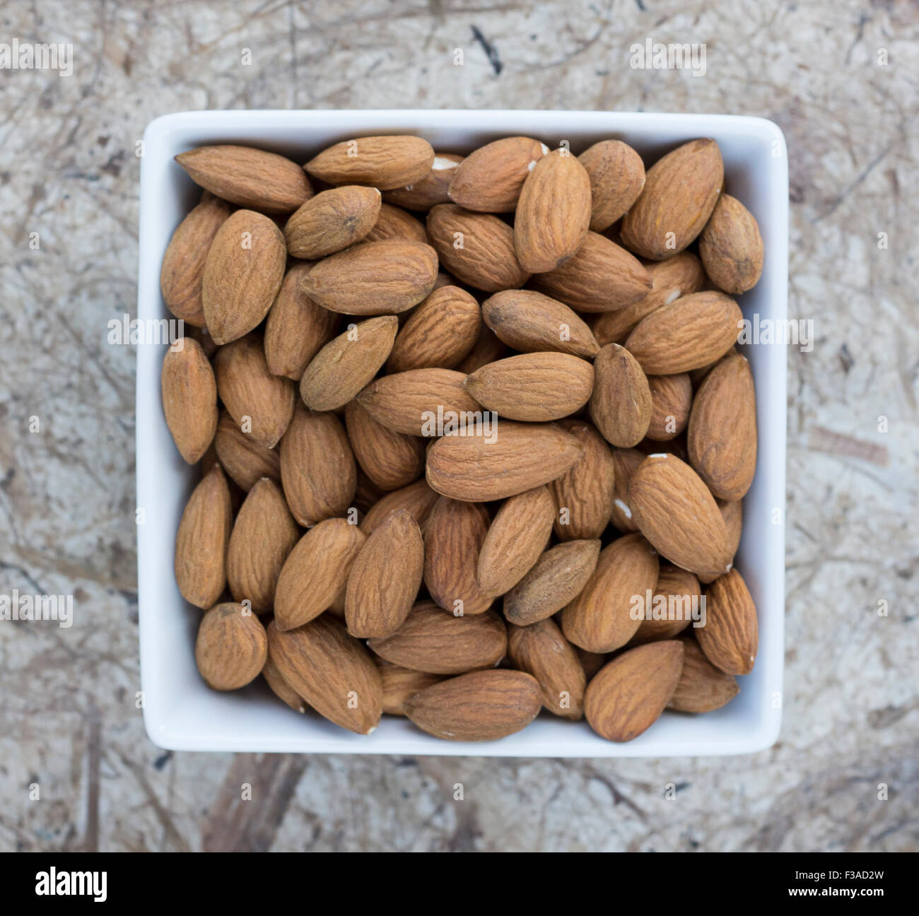 Almonds in a bowl Stock Photo